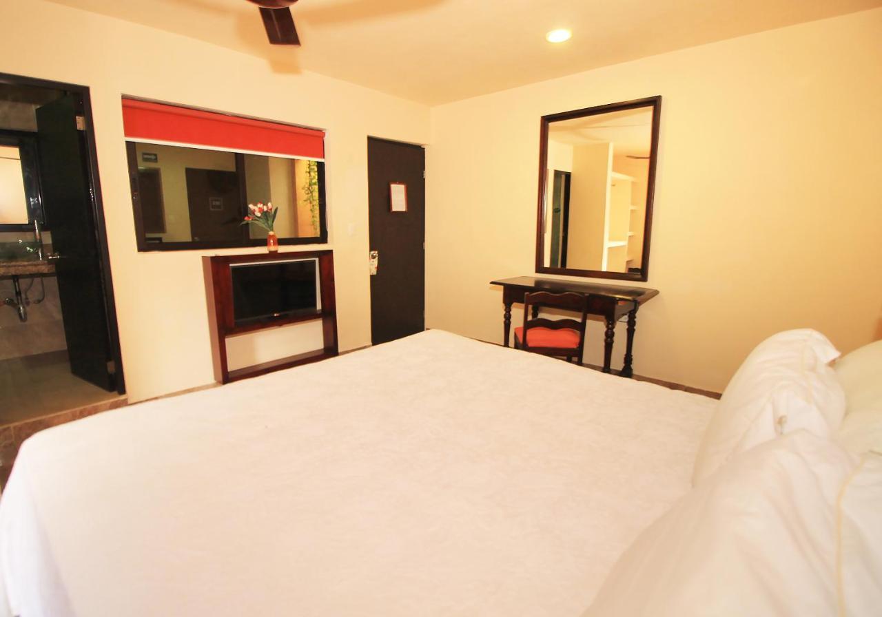 Papagayo Hotel Boutique Playa del Carmen Dış mekan fotoğraf A room at the hotel