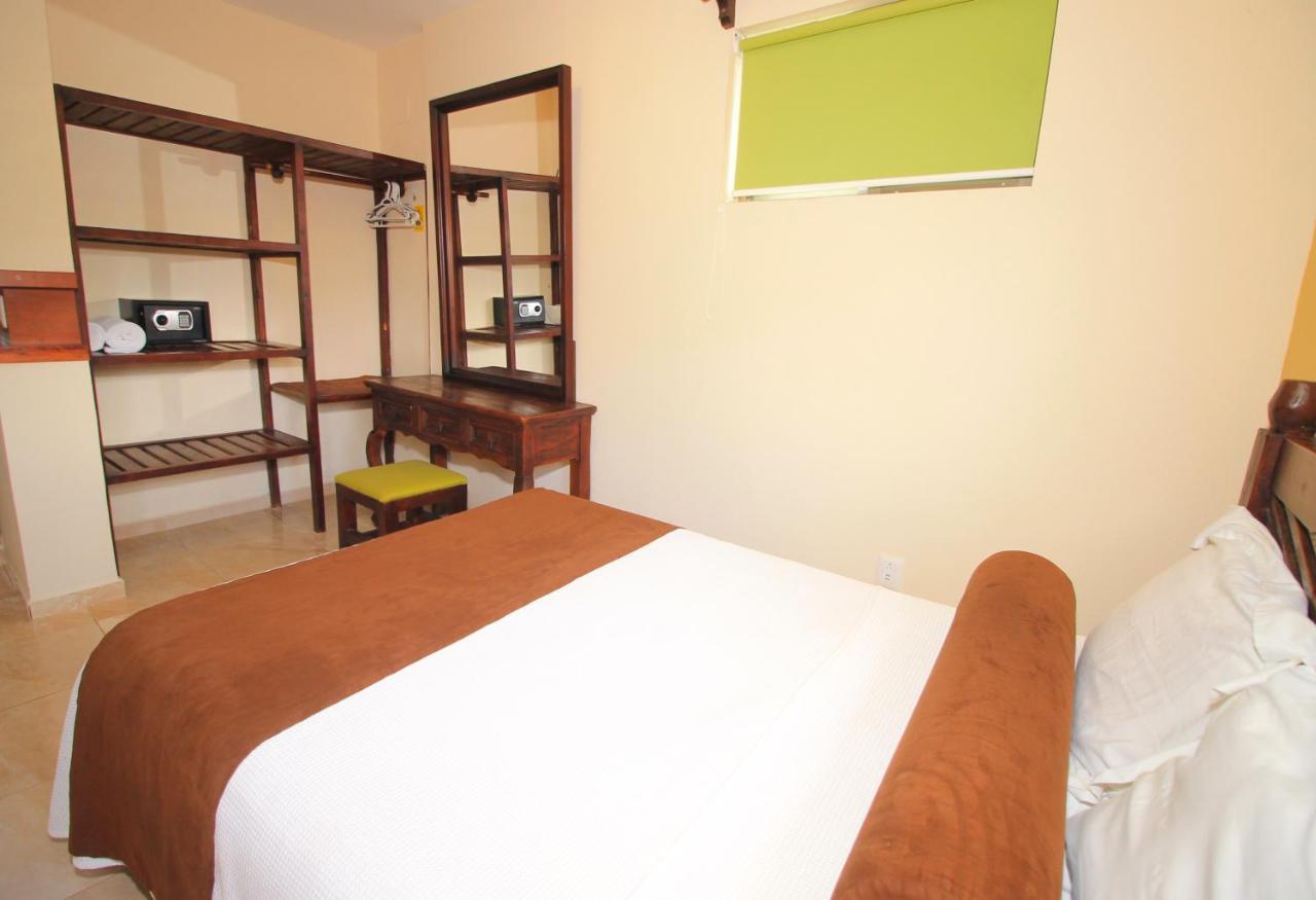 Papagayo Hotel Boutique Playa del Carmen Dış mekan fotoğraf A bedroom at the hotel